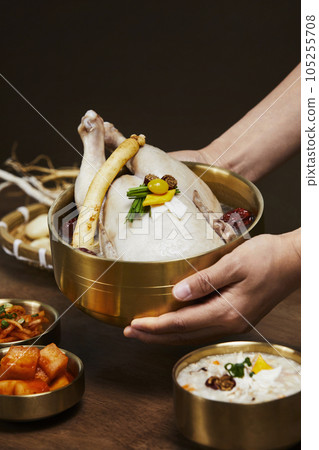 korean traditional food samgyetang, chicken soup with ginseng served korean traditional food samgyetang, chicken soup with ginseng served 105255708