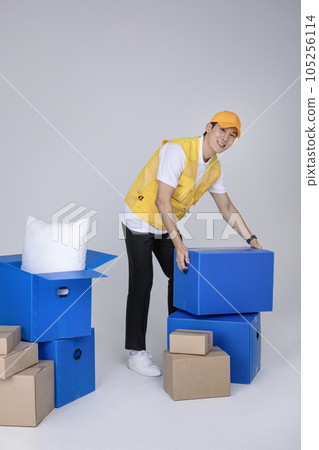 millennials and gen z, korean asian young man organizing moving boxes 105256114