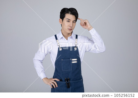 millennials and gen z, korean asian young man standing with hand motion millennials and gen z, korean asian young man standing with hand motion 105256152