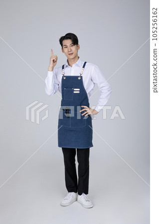 millennials and gen z, korean asian young man pointing millennials and gen z, korean asian young man pointing 105256162