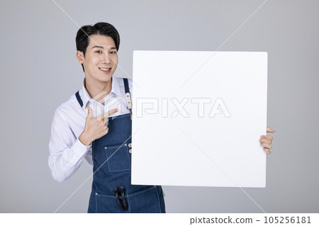 millennials and gen z, korean asian young man holding a frame panel 105256181