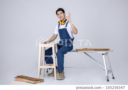 millennials and gen z, korean asian young man carpenter with furniture 105256347
