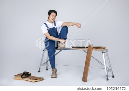 millennials and gen z, korean asian young man carpenter sitting millennials and gen z, korean asian young man carpenter sitting 105256572