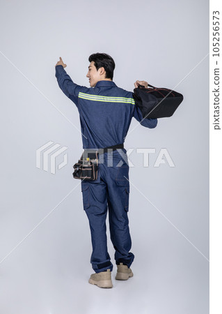 millennials and gen z, korean asian young man, site staff pointing millennials and gen z, korean asian young man, site staff pointing 105256573