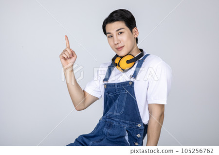 millennials and gen z, korean asian young man carpenter with hand motion millennials and gen z, korean asian young man carpenter with hand motion 105256762