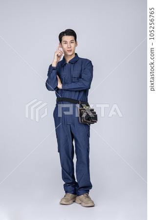 millennials and gen z, korean asian young man, site staff wearing overall 105256765