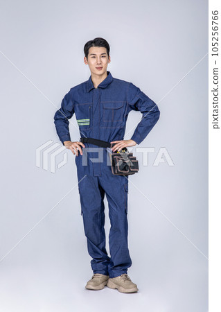 millennials and gen z, korean asian young man, site staff with hands on waist millennials and gen z, korean asian young man, site staff with hands on waist 105256766