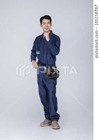 millennials and gen z, korean asian young man, site staff with hand motion millennials and gen z, korean asian young man, site staff with hand motion 105256767