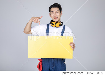 millennials and gen z, korean asian young man carpenter with a frame panel 105256848