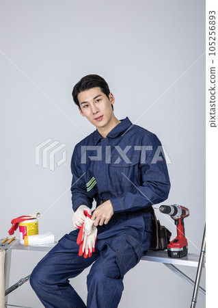 millennials and gen z, korean asian young man with cotton work gloves 105256893