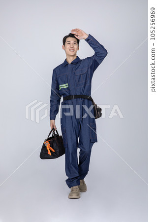 millennials and gen z, korean asian young man, site staff walking millennials and gen z, korean asian young man, site staff walking 105256969