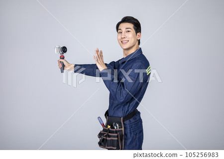 millennials and gen z, korean asian young man, site staff filming 105256983
