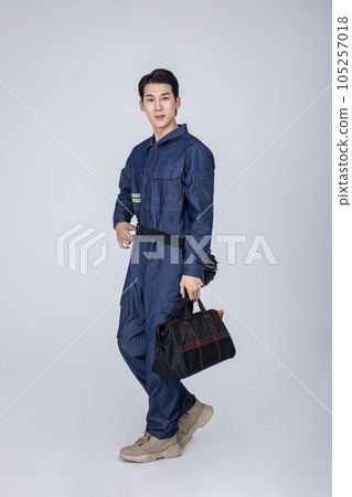 millennials and gen z, korean asian young man, site staff with a bag 105257018