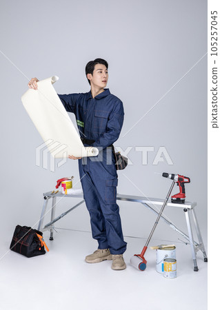 millennials and gen z, korean asian young man, site staff with blueprint 105257045