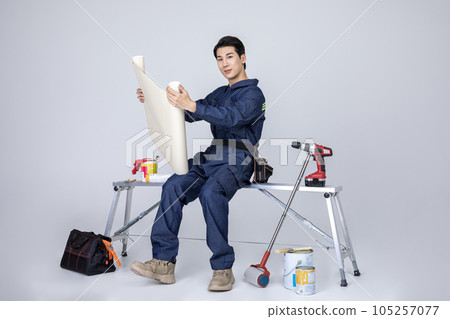 millennials and gen z, korean asian young man, site staff with blueprint millennials and gen z, korean asian young man, site staff with blueprint 105257077