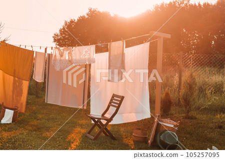 A place for drying linen, sheets and clothes on the street in the courtyard of a village house. The concept of autumn. 105257095