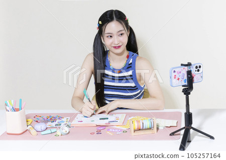 vintage y2k retro concept photo of korean asian cute woman filming diary decoration 105257164