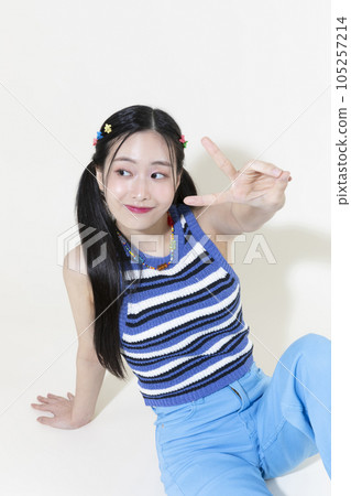 vintage y2k retro concept photo of korean asian cute woman sitting and posing 105257214
