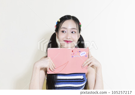 vintage y2k retro concept photo of korean asian cute woman with diary 105257217