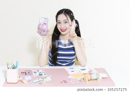 vintage y2k retro concept photo of korean asian cute woman decorating a diary 105257275