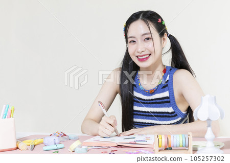 vintage y2k retro concept photo of korean asian cute woman decorating diary 105257302