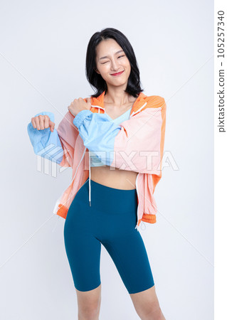 healthy beauty concept photo of korean asian beautiful woman stretching with jacket healthy beauty concept photo of korean asian beautiful woman stretching with jacket 105257340