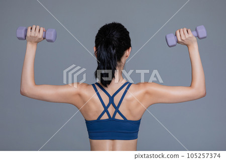 healthy beauty concept photo of korean asian beautiful woman with dumbbell healthy beauty concept photo of korean asian beautiful woman with dumbbell 105257374