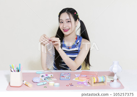vintage y2k retro concept photo of korean asian cute woman with diary and stickers 105257375