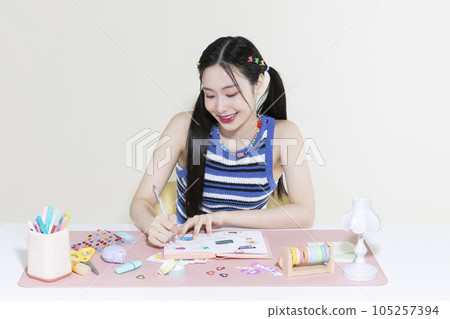 vintage y2k retro concept photo of korean asian cute woman decorating diary vintage y2k retro concept photo of korean asian cute woman decorating diary 105257394