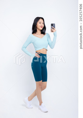 healthy beauty concept photo of korean asian beautiful woman with smartphone healthy beauty concept photo of korean asian beautiful woman with smartphone 105257406