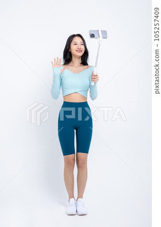 healthy beauty concept photo of korean asian beautiful woman filming with smartphone healthy beauty concept photo of korean asian beautiful woman filming with smartphone 105257409