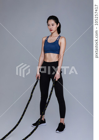 healthy beauty concept photo of korean asian beautiful woman with battling ropes 105257417