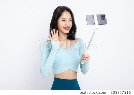 healthy beauty concept photo of korean asian beautiful woman filming with smartphone 105257516