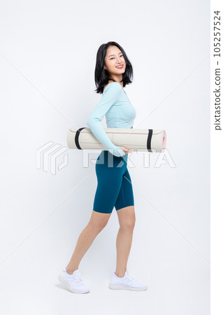 healthy beauty concept photo of korean asian beautiful woman with yoga mat healthy beauty concept photo of korean asian beautiful woman with yoga mat 105257524