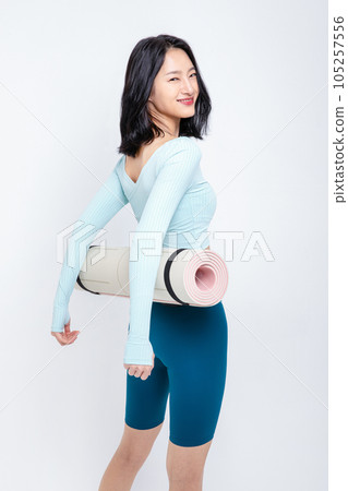healthy beauty concept photo of korean asian beautiful woman with yoga mat 105257556