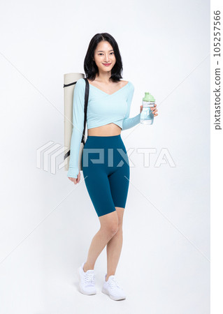 healthy beauty concept photo of korean asian beautiful woman with yoga mat and tumbler healthy beauty concept photo of korean asian beautiful woman with yoga mat and tumbler 105257566