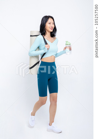 healthy beauty concept photo of korean asian beautiful woman with yoga mat and tumbler healthy beauty concept photo of korean asian beautiful woman with yoga mat and tumbler 105257580