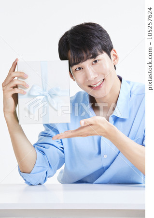 korean asian young man with gift box korean asian young man with gift box 105257624