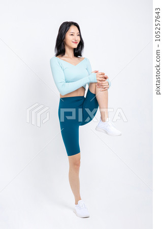 healthy beauty concept photo of korean asian beautiful woman stretching healthy beauty concept photo of korean asian beautiful woman stretching 105257643