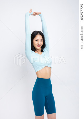healthy beauty concept photo of korean asian beautiful woman stretching healthy beauty concept photo of korean asian beautiful woman stretching 105257725