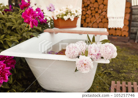 A place for washing and drying clothes, sheets and clothes on the street in the courtyard of a village house. Bathroom in the street courtyard. The concept of autumn 105257746