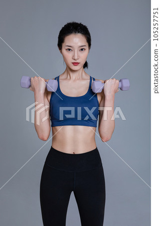 healthy beauty concept photo of korean asian beautiful woman with dumbbell healthy beauty concept photo of korean asian beautiful woman with dumbbell 105257751