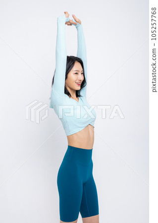 healthy beauty concept photo of korean asian beautiful woman stretching healthy beauty concept photo of korean asian beautiful woman stretching 105257768