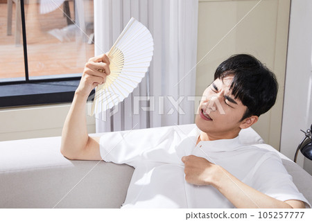 summer lifestyle, korean asian young man fanning 105257777
