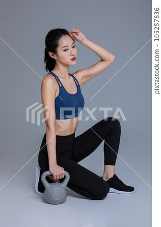 healthy beauty concept photo of korean asian beautiful woman with kettlebell healthy beauty concept photo of korean asian beautiful woman with kettlebell 105257836