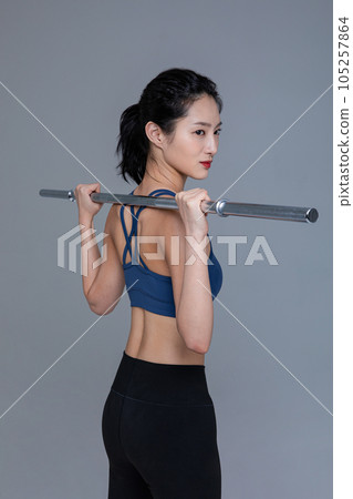healthy beauty concept photo of korean asian beautiful woman with barbell healthy beauty concept photo of korean asian beautiful woman with barbell 105257864