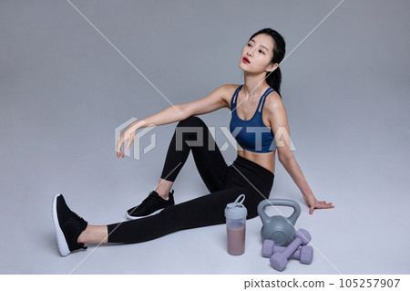 healthy beauty concept photo of korean asian beautiful woman with fitness machine 105257907