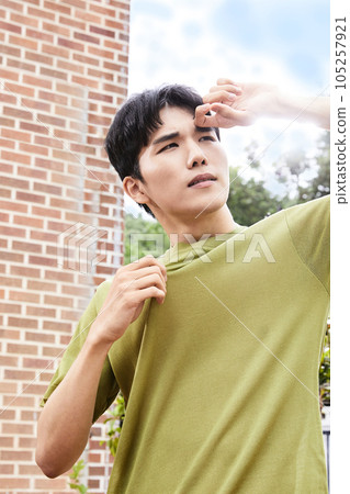 summer lifestyle, korean asian young man and shield the sun 105257921