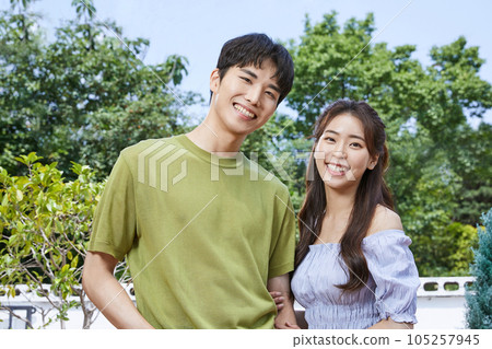 summer lifestyle, smiling korean asian young couple outdoor summer lifestyle, smiling korean asian young couple outdoor 105257945
