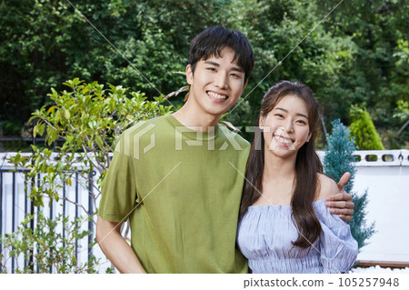summer lifestyle, smiling korean asian young couple outdoor summer lifestyle, smiling korean asian young couple outdoor 105257948